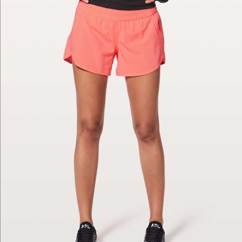 Neon pinkish orangeish lululemon Tracker V shorts